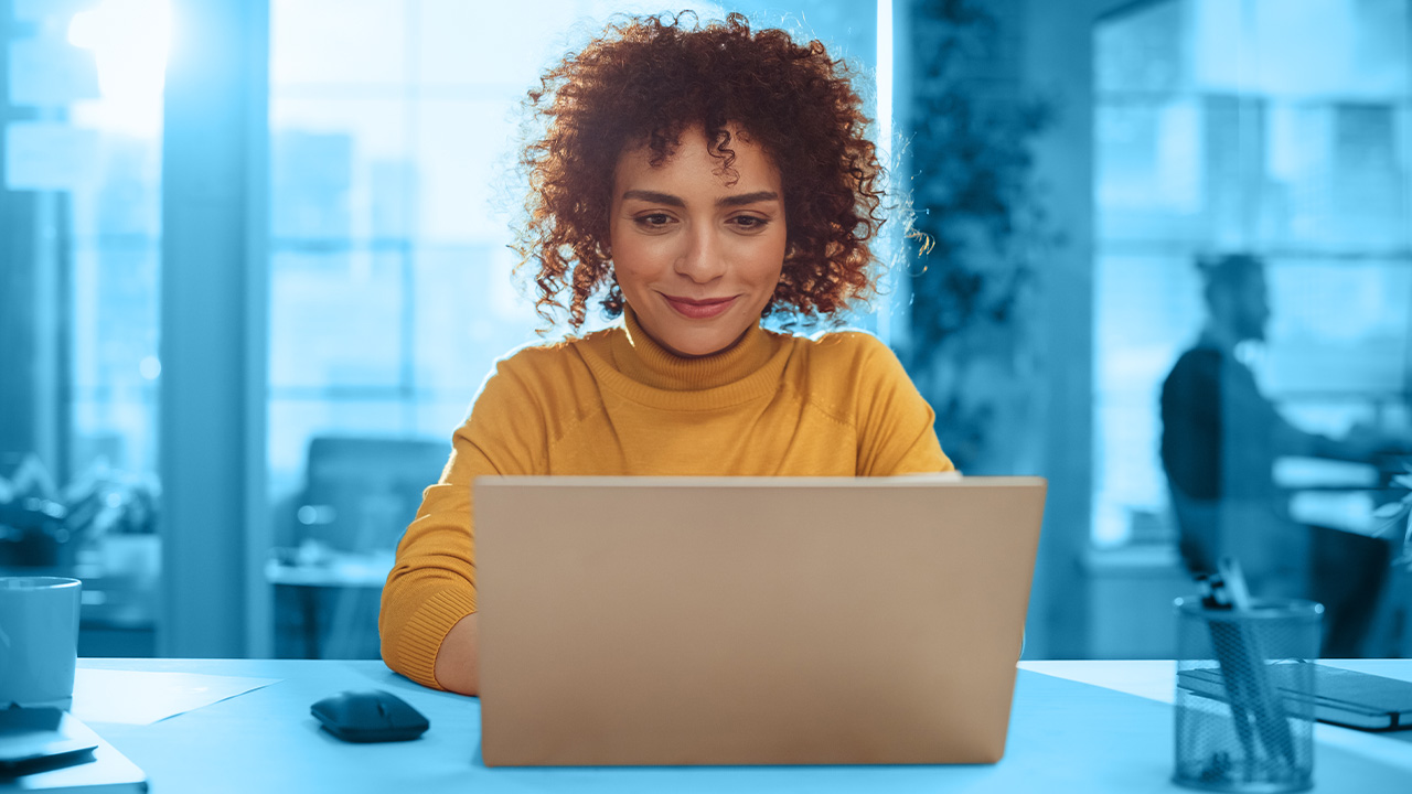 Woman watching a webcast on her computer